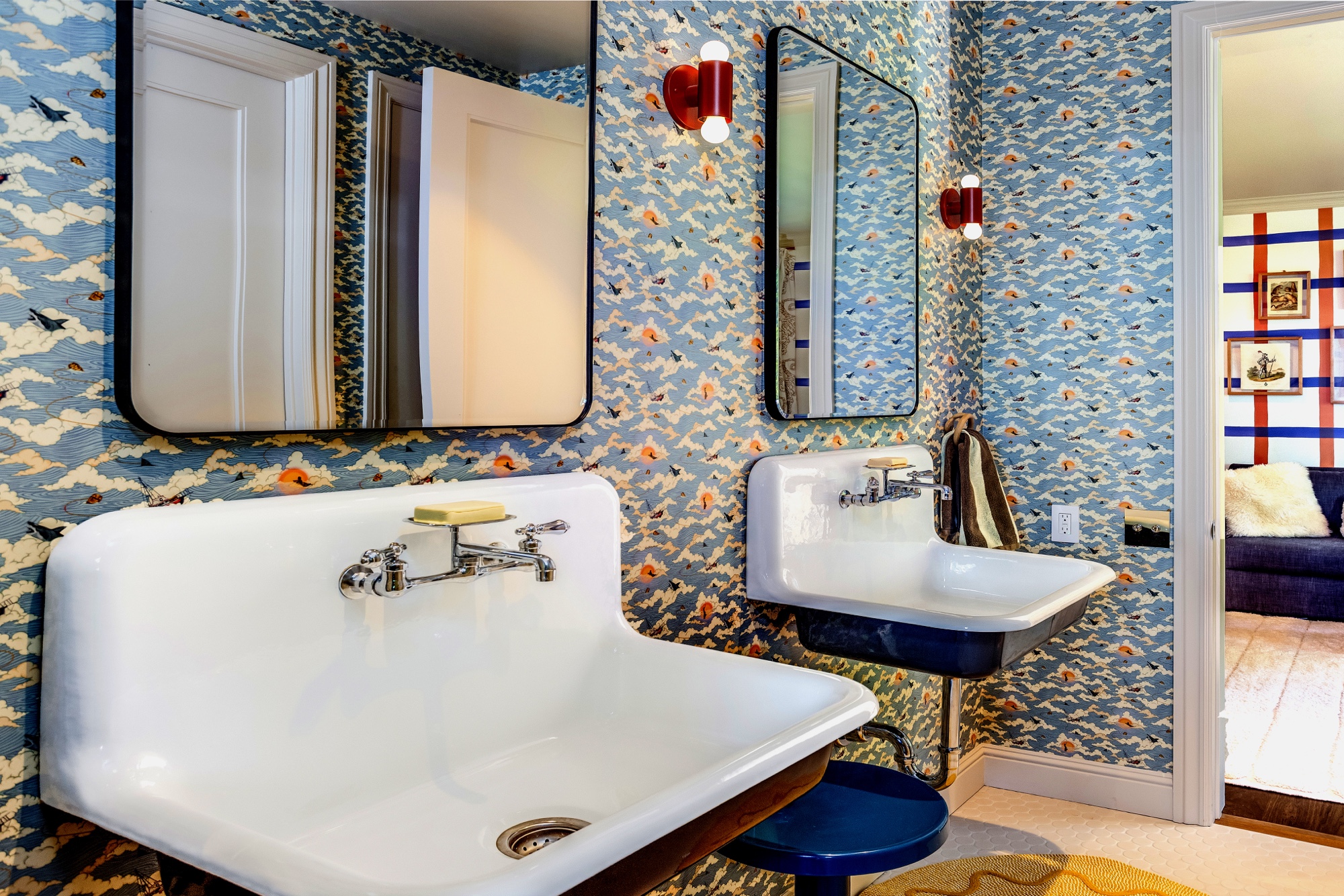 Bathroom with blue patterned wallcovering and white basin by M2