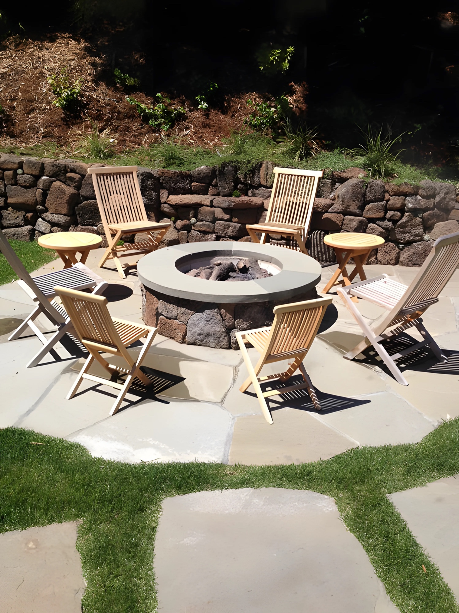 Built outdoor firepit with bench seating by M2