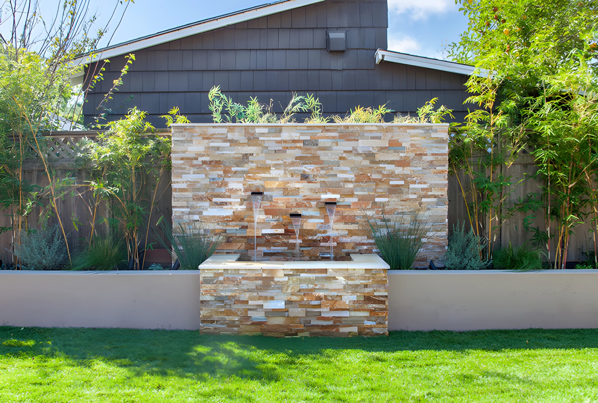 Stone landscape water feature with planting