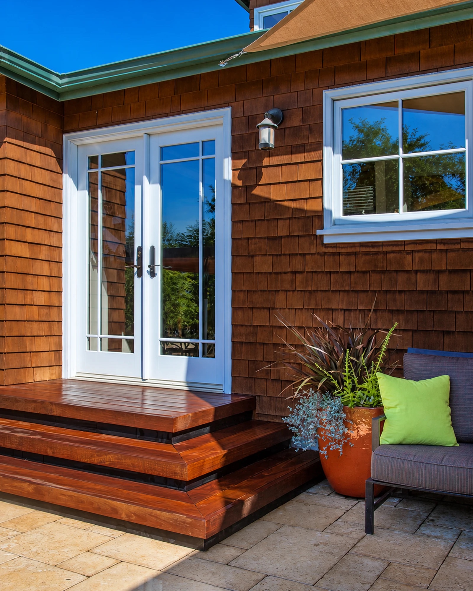 Cedar-shingle garden entry with custom wood steps and planting by M2